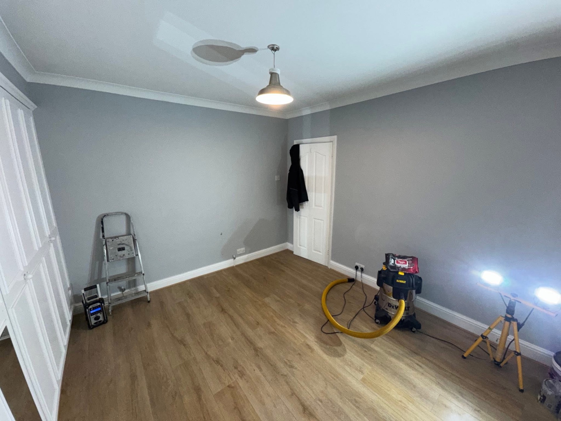 Dustless sanding and extraction equipment set up in a bedroom