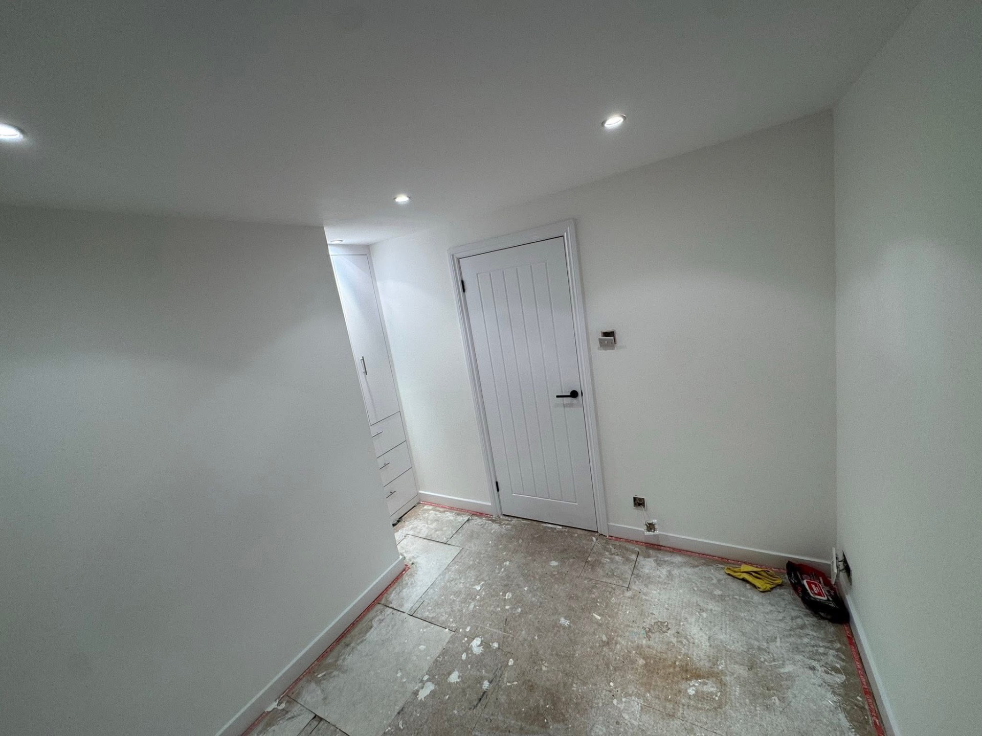 Room freshly painted in brilliant white during a rental refresh