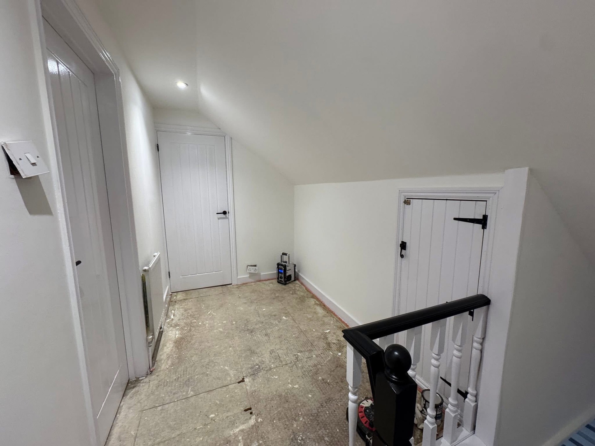 Landing repainted in white ahead of new flooring