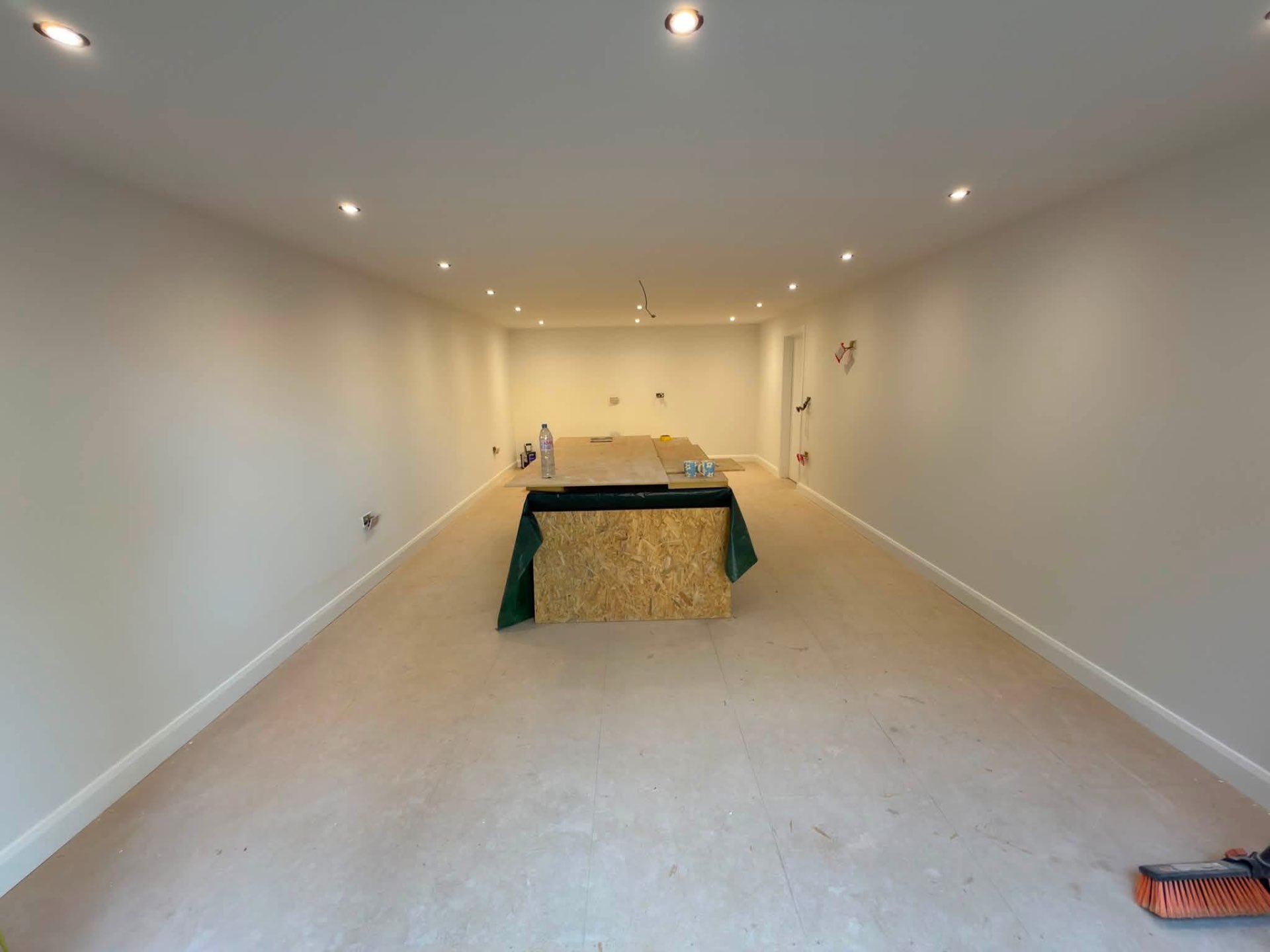 Large open room freshly decorated in a warm neutral throughout